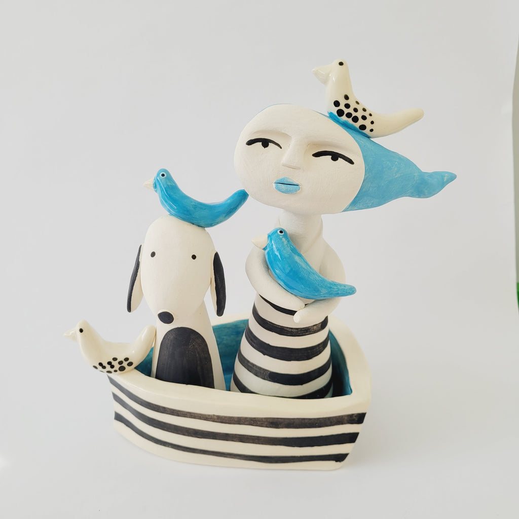 Windswept Lady and Dog Boat